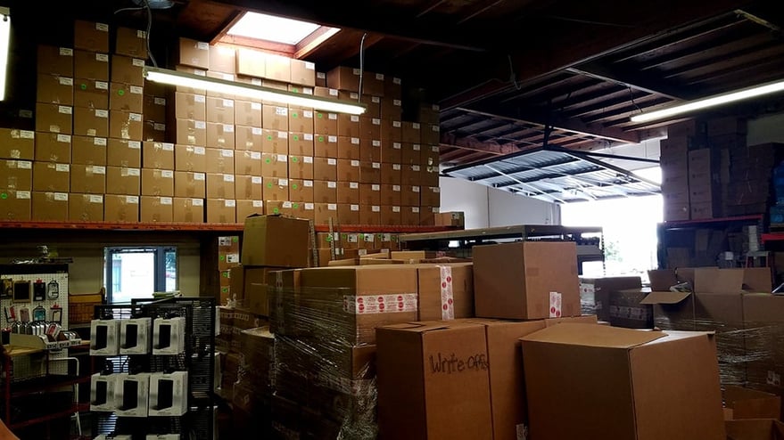 Jason Bobb's warehouse with boxes of Magpul Cases in stock. Each box is 100 units. "We are highly invested in the brand as you can see."