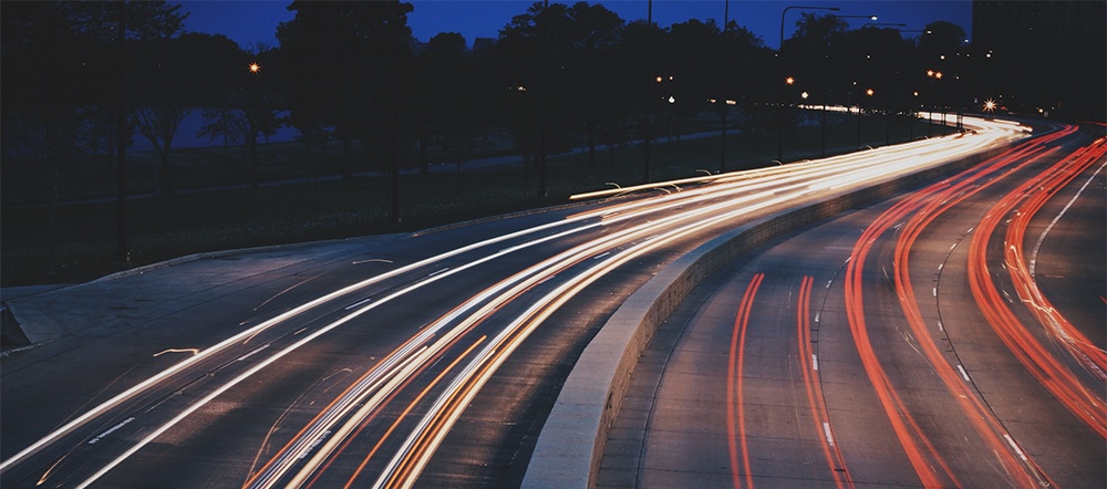 cars moving quickly on a highway