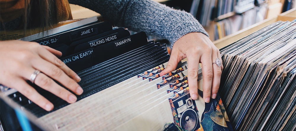 woman buying records for retail arbitrage